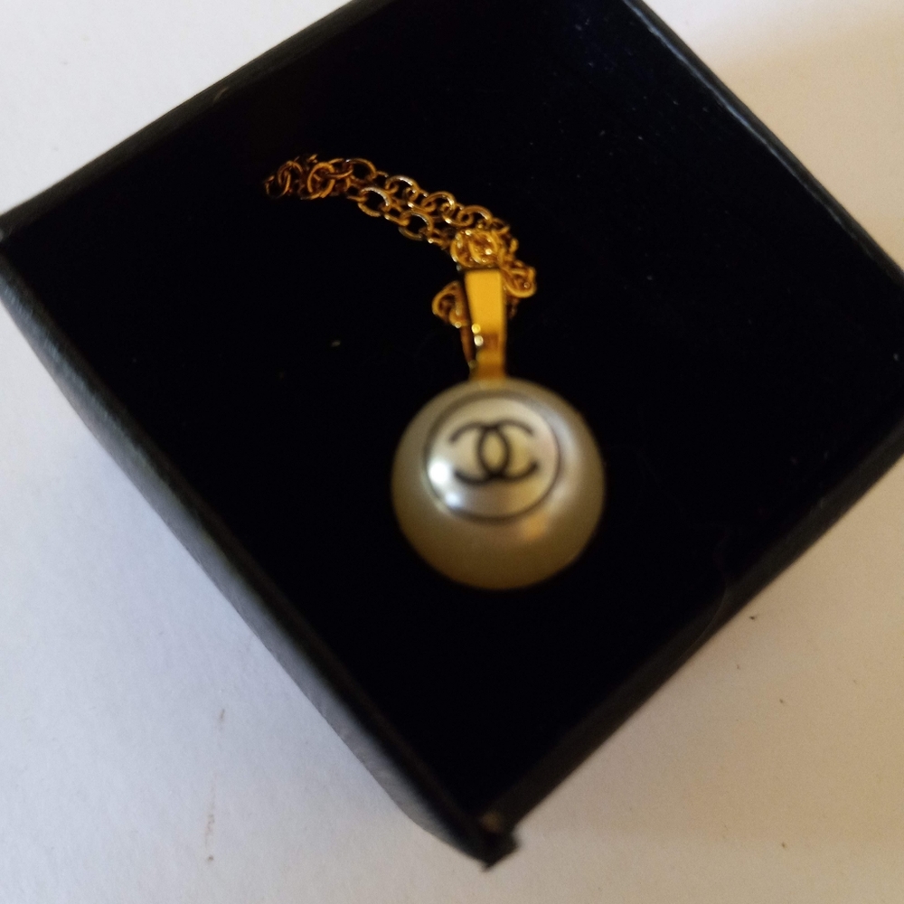 Tiny authentic Chanel button necklace